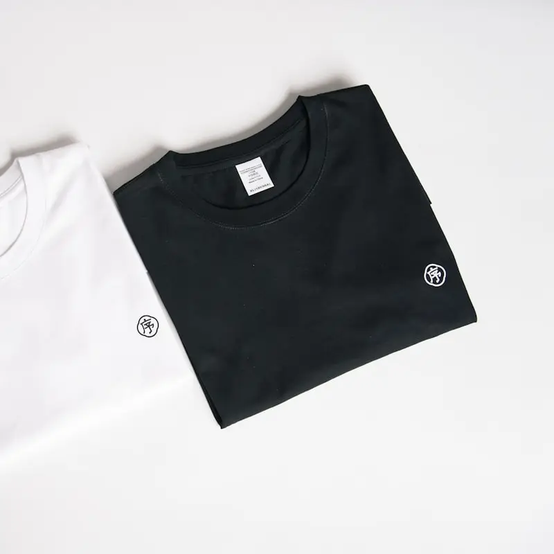 Folded black and white T-shirts