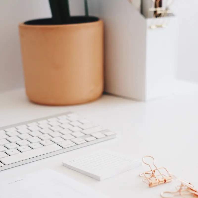 Desk accessories arranged on a white desk