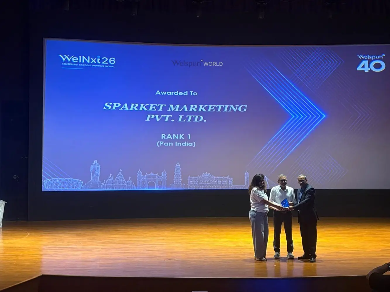Sparket receiving the Rank 1 award on stage at Welspun WelNxt 26