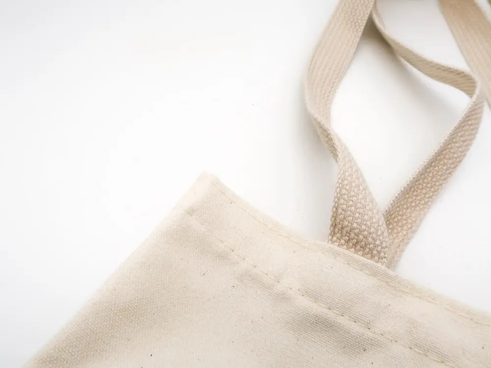 A plain cream canvas tote bag ready for branding